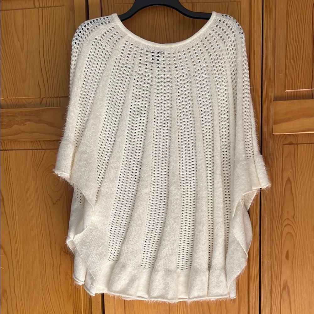 Lauren Michelle Cream with shimmering threads, sewn throughout Knit Poncho